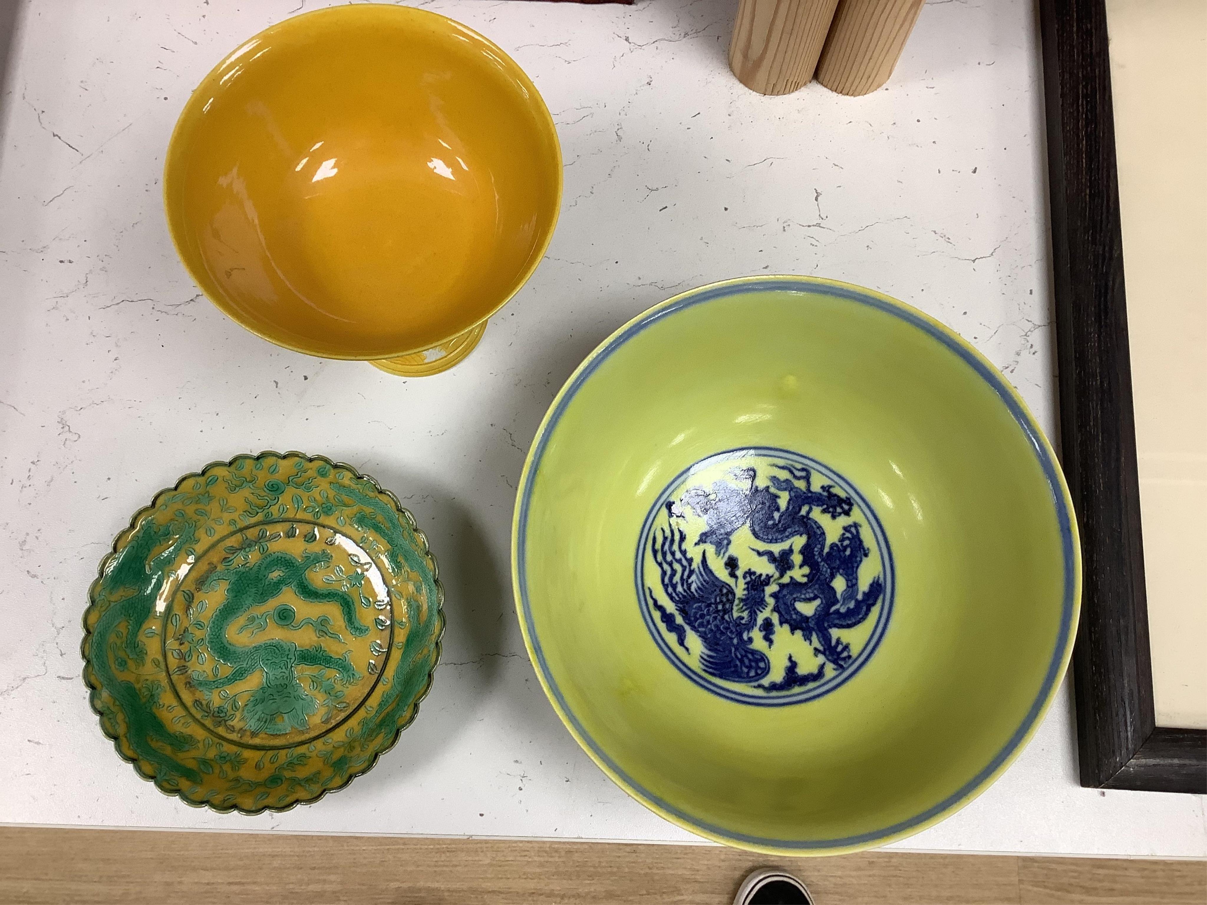A Chinese yellow ground underglaze blue 'dragon' bowl, boxed, a yellow and green 'dragon' dish and a similar stem cup, yellow bowl 19.5cm diameter. Condition - good